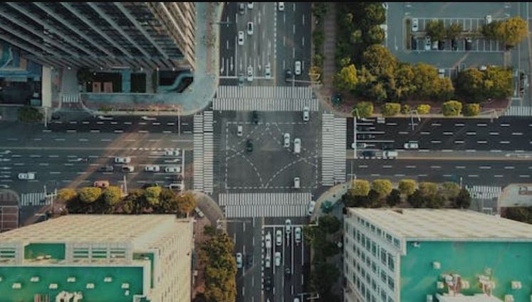 Birdseye view aerial of city intersection b-roll footage for interviews.